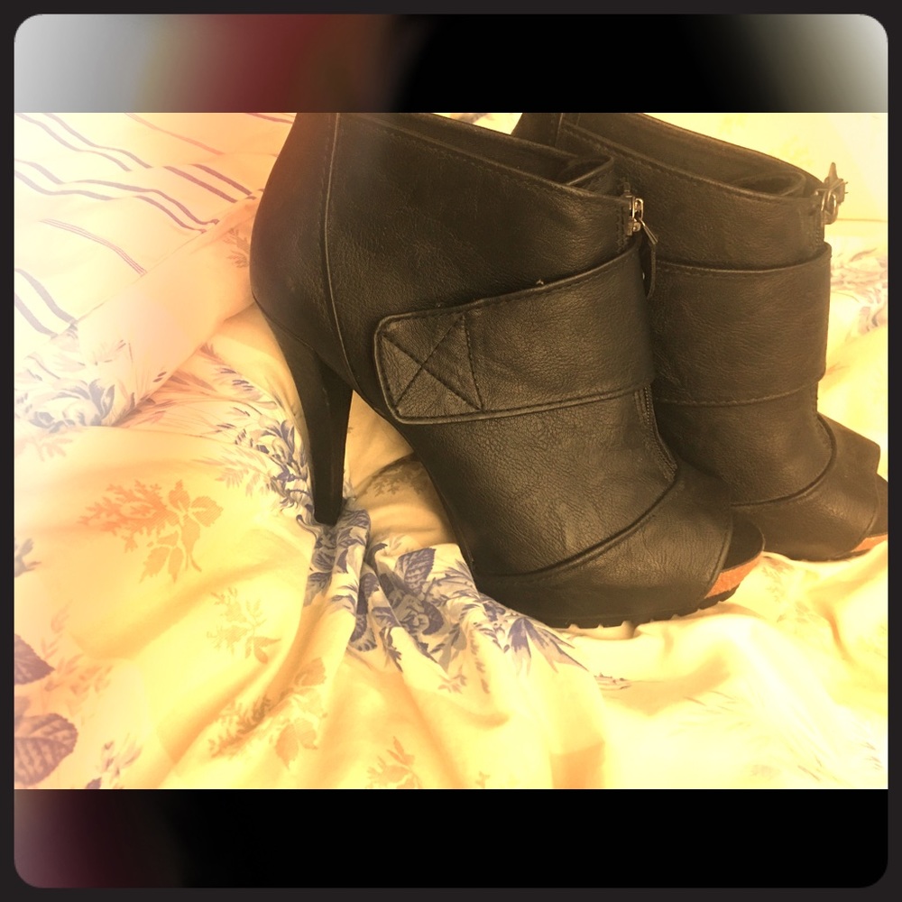 Black heeled open toe boots